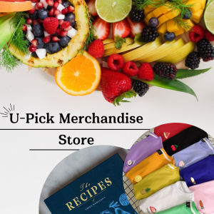 Farm-fresh fruit display and U-Pick merchandise including recipe books and colorful apparel.
