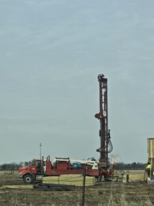 High-capacity well drilling installation for orchard irrigation at Nuts About Dee’s Berries agroforestry farm in Brodhead Wisconsin