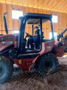 Ditch Witch RT125 trencher used to install the orchard irrigation mainline at Nuts About Dee's Berries.